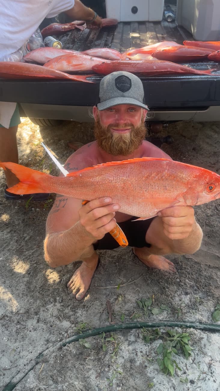 Angler holding a trophy-class vermilion snapper